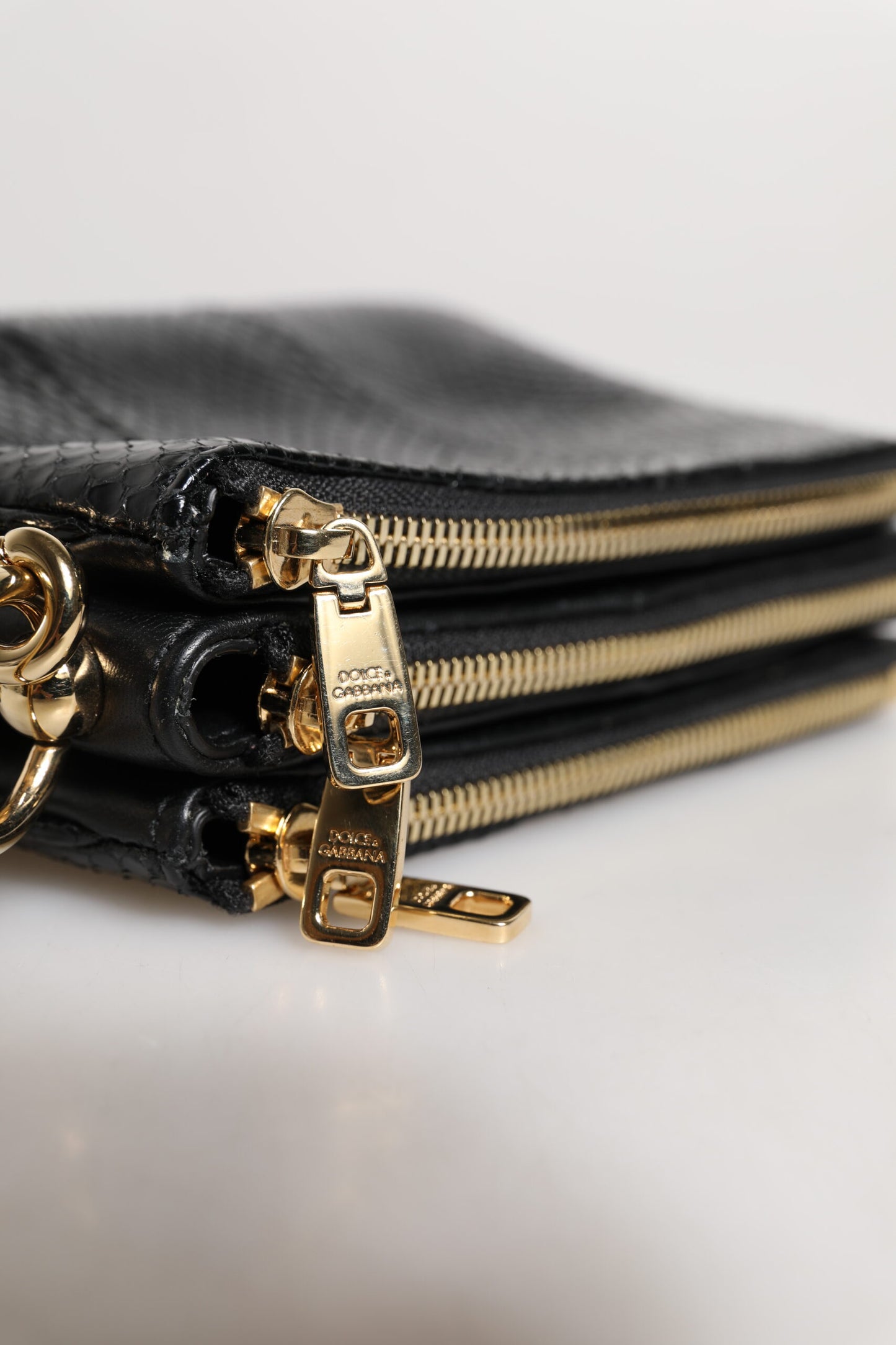 Dolce & Gabbana – Schwarze Clutch aus exotischem Leder
