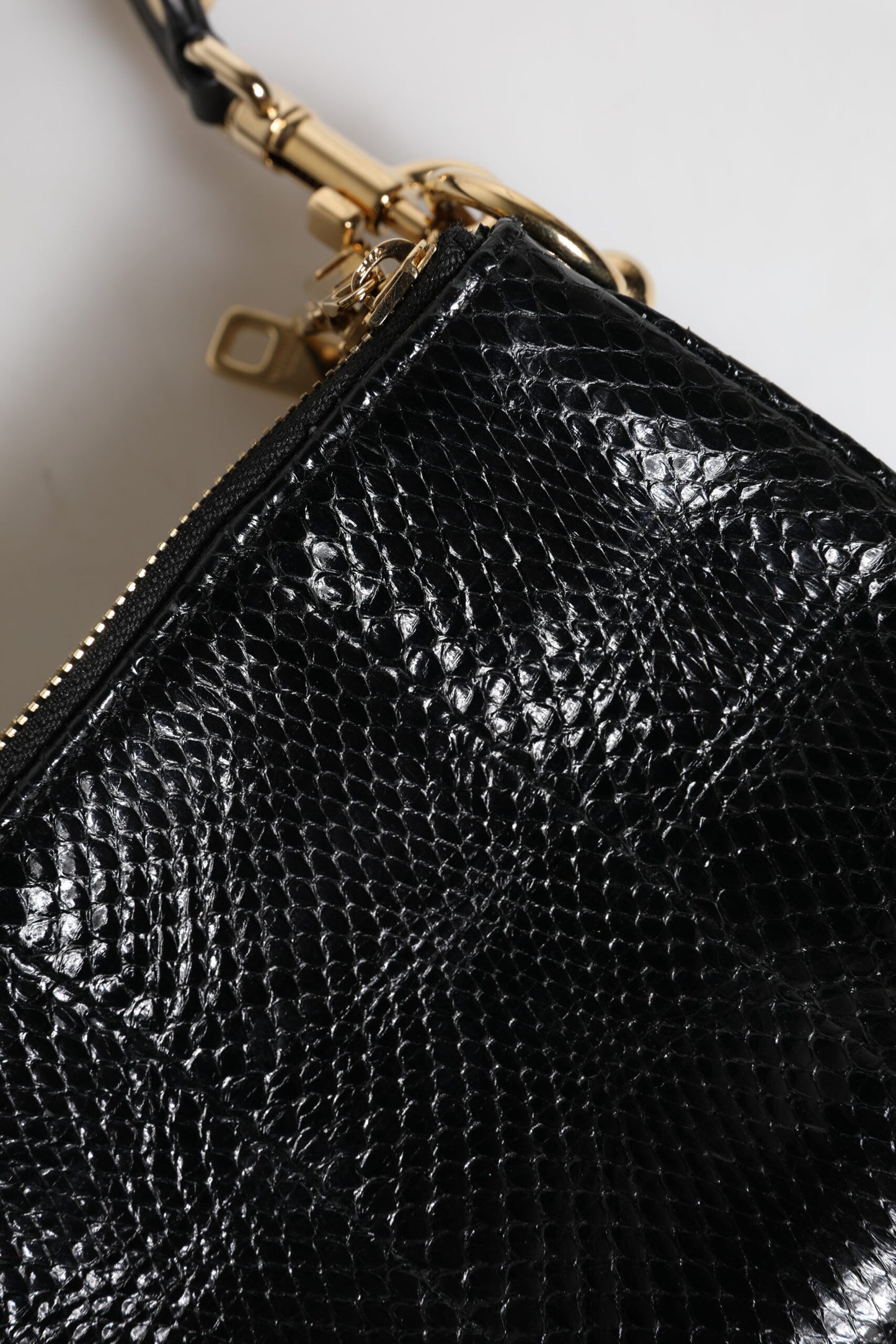 Dolce & Gabbana – Schwarze Clutch aus exotischem Leder