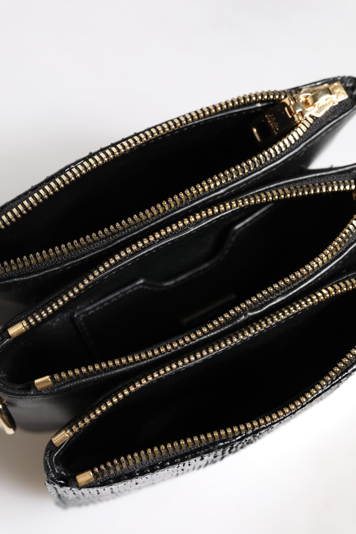 Dolce & Gabbana – Schwarze Clutch aus exotischem Leder