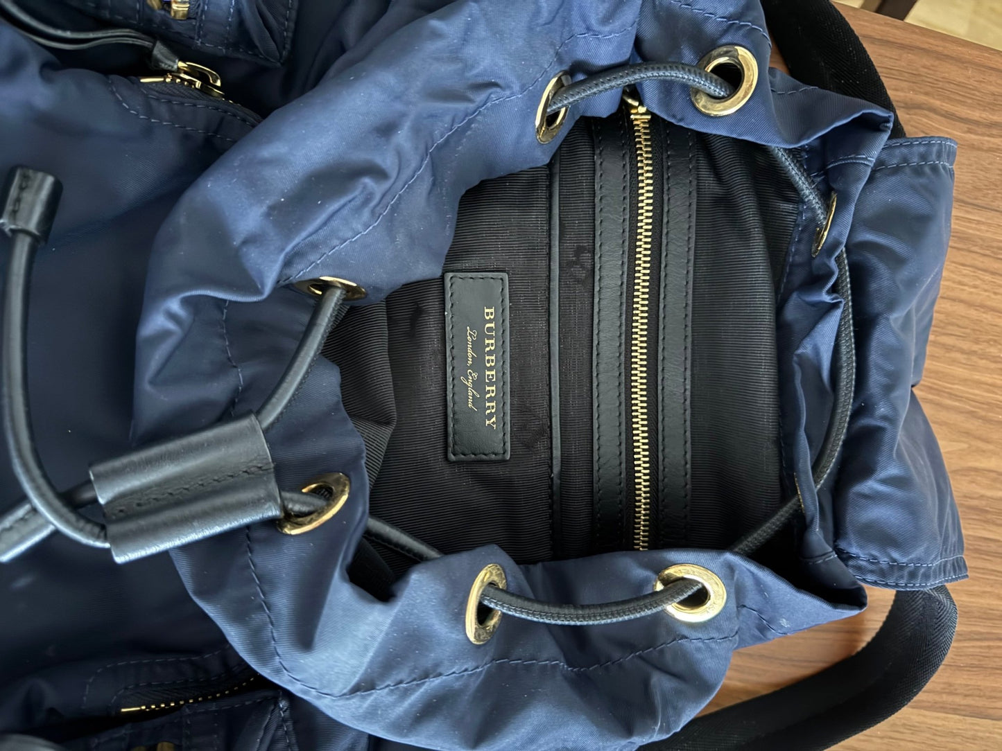 Burberry The Rucksack Backpack in Navy with Golden Hardware at The Platonist